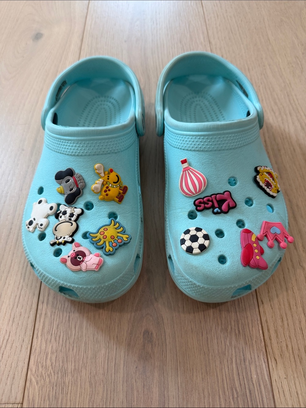 Womens Light Blue Crocs Shoes with Decorative Charms Size 8